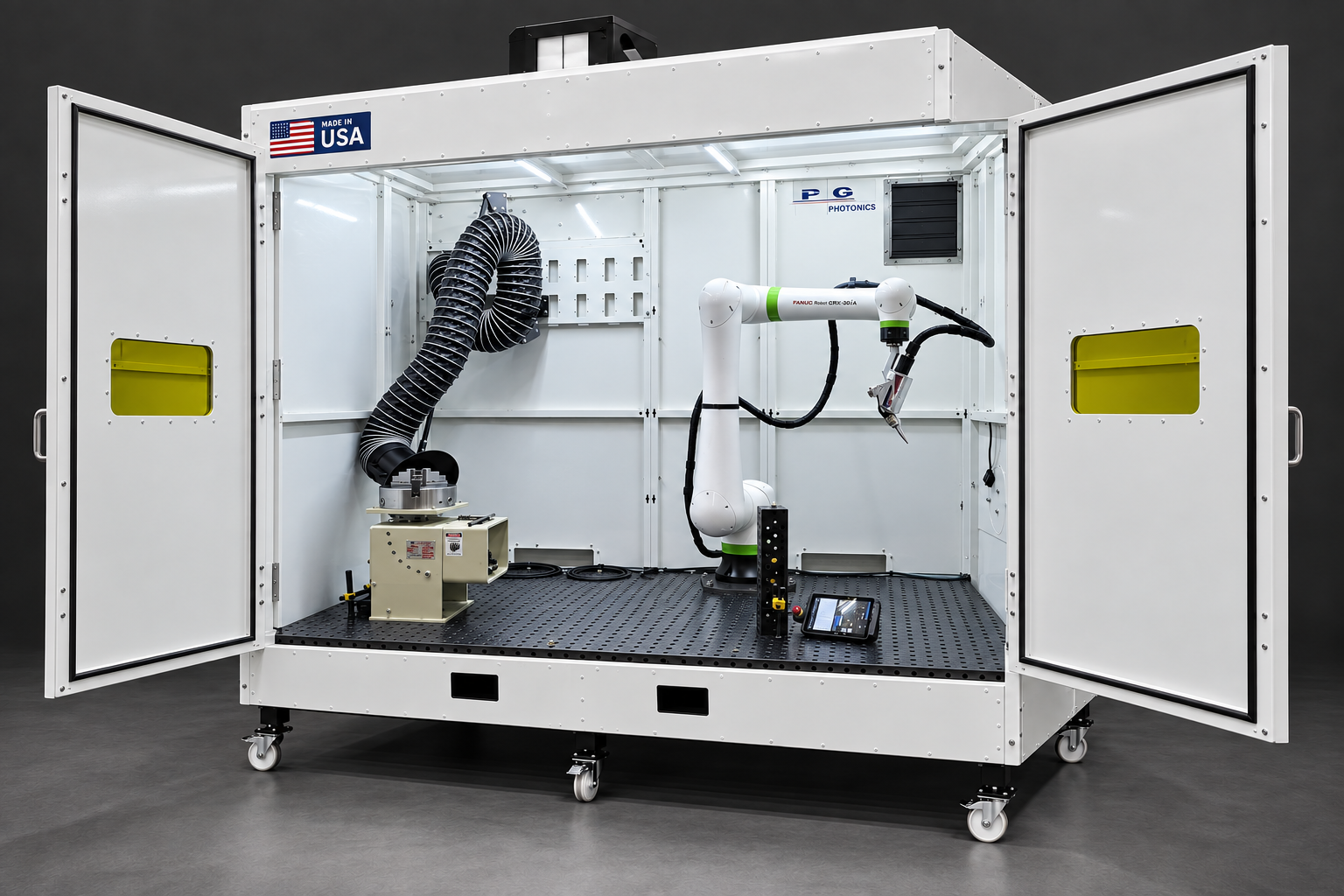 Open LightBOT enclosure showing a FANUC robot, welding table and built-in fume extraction hose.
