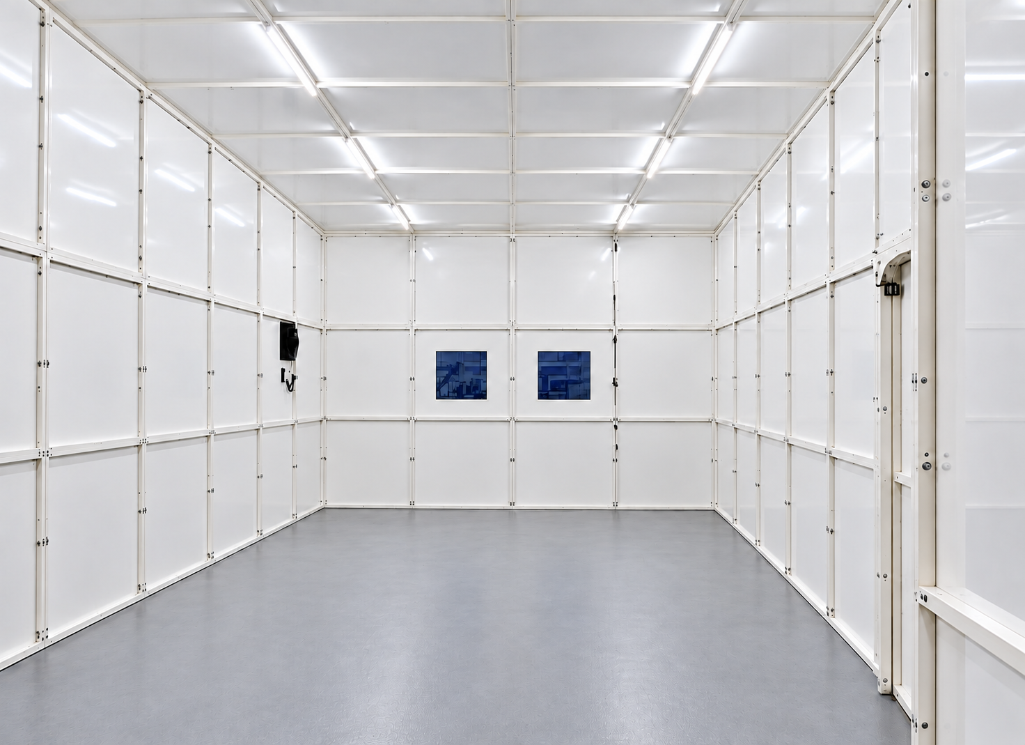 Clean white LightSAFE interior with ceiling lighting, modular wall framing and two viewing windows.